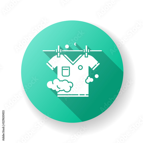 Outdoor drying green flat design long shadow glyph icon. Laundry, clothesline, outside clothes drying. T-shirt hanging on rope, clean clothing, washed garment. Silhouette RGB color illustration