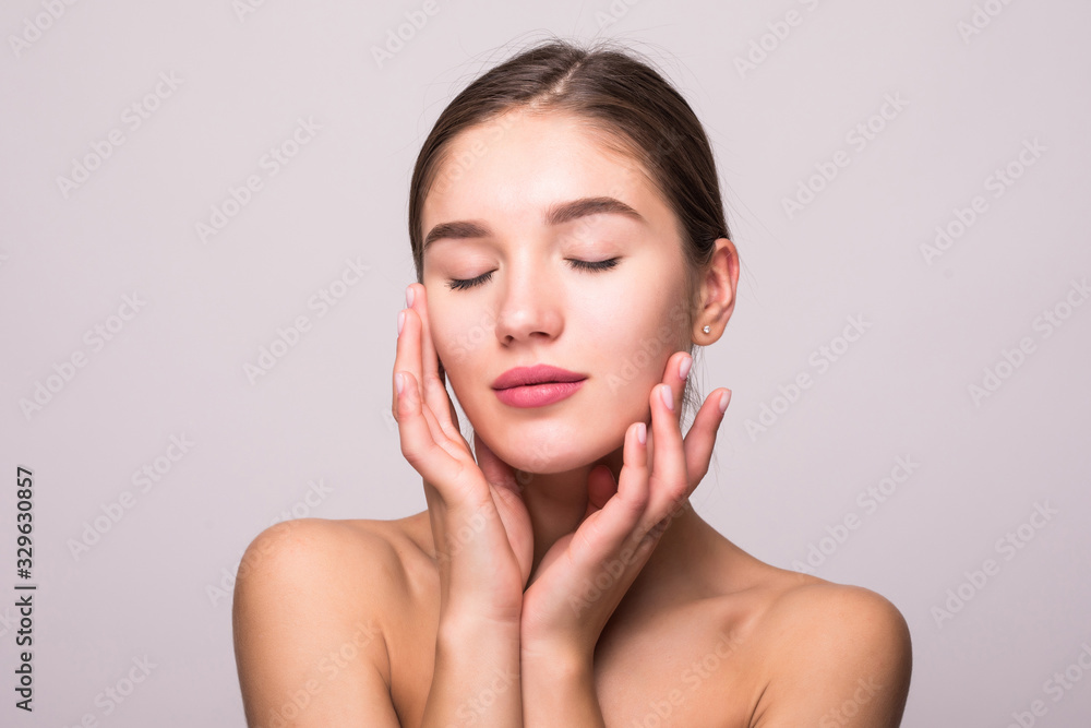Pretty face of beautiful smiling woman posing at studio isolated on white background Pretty face of beautiful smiling woman posing at studio isolated on white background