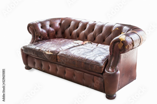 vintage style . Defective old leather sofa on white background