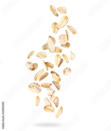 Oat flakes frozen in the air, isolated on white background photo
