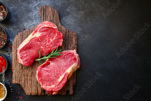 raw steak meat (beef or veal cooking) menu concept background. top view. copy spaces for text 