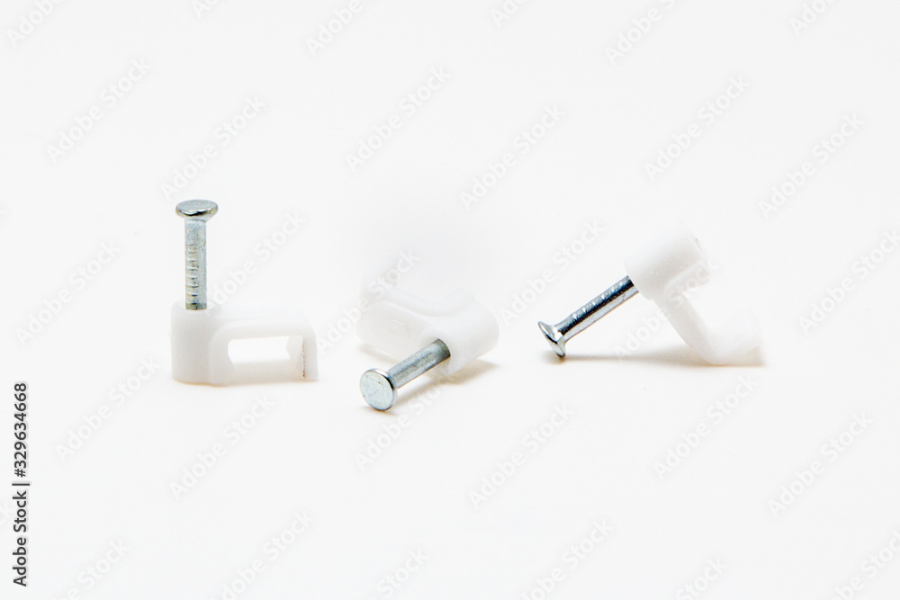 The holder for the wires on the wall isolated on white The holder for the wires on the wall isolated on white
