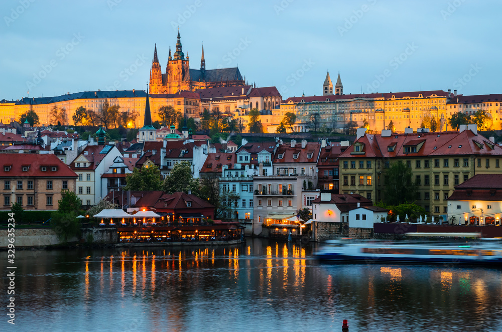 Old Town architecture and  Vltava river at night in Prague, Czech Republic.