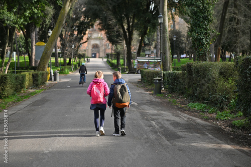Wallpaper Mural children marching with backpacks on the road during the day to school... Torontodigital.ca