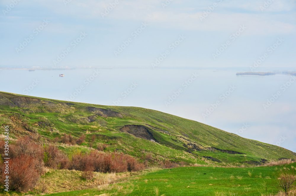 Mountain sea shore in the fall against the blue sky with clouds. Mountain sea shore in the fall against the blue sky with clouds.