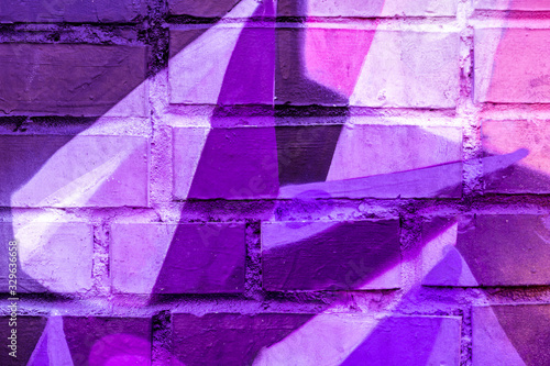 Beautiful bright colorful street art graffiti background. Abstract creative spray drawing fashion colors on the walls of the city. Urban Culture, black ,blue, purple , violet , neon texture