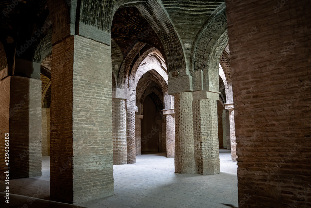 Ancient columns of hypostyle hall inside the Jameh Mosque of Isfahan.