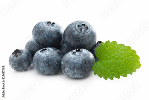 Fresh blueberries and lemon balm isolated against white photo