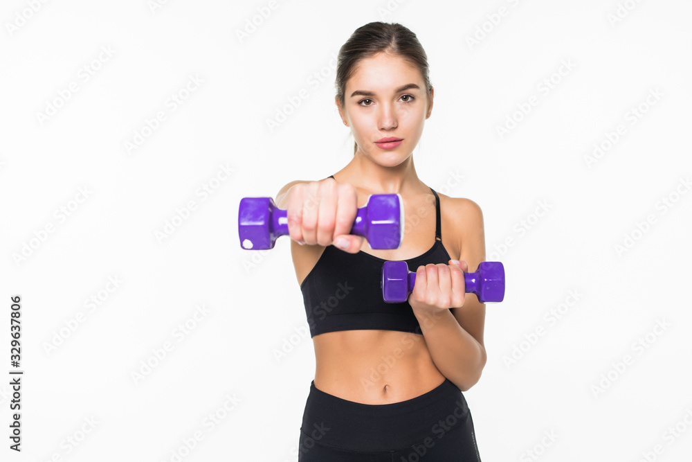 Young fitness woman working out with dumbbell isolated white background Young fitness woman working out with dumbbell isolated white background