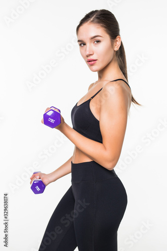 Athletic fitness girl with dumbbells on a white background
