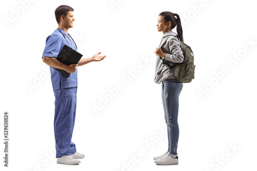 Male doctor taking to a female student