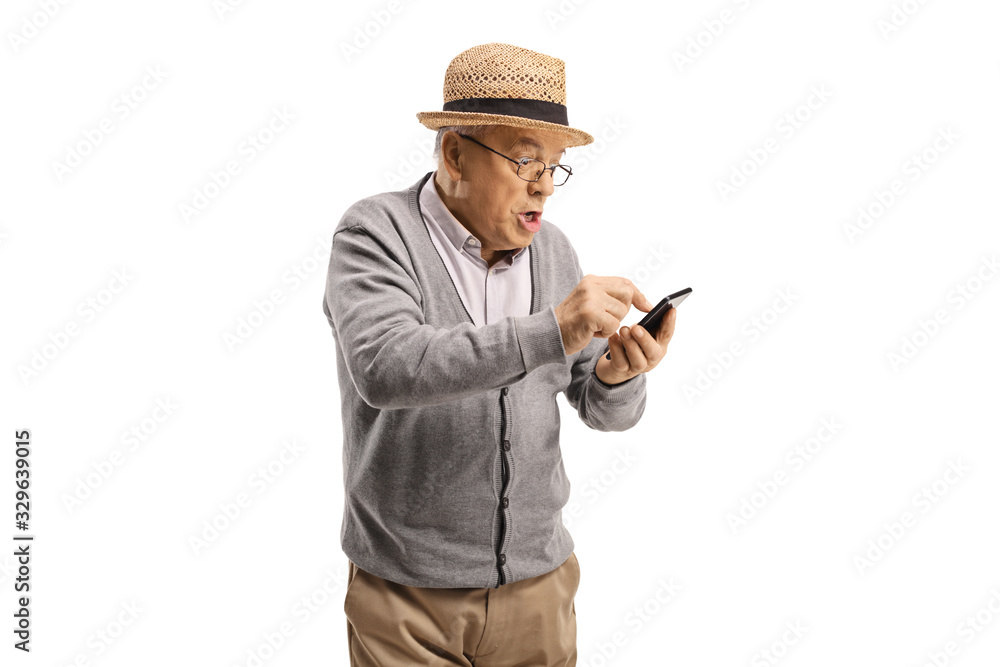 Surprised senior man using a touch screen mobile phone