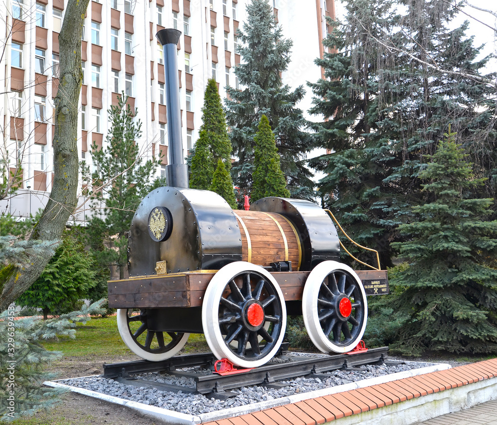 KALININGRAD, RUSSIA. Model of the first Russian locomotive Cherepanov (1833). Russian text - steam locomotive E.A. and M.E. Cherepanov