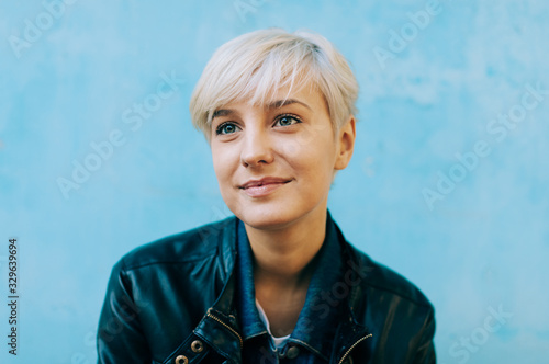Bild auf Leinwand casual portrait of beautifu blond young woman outdoors