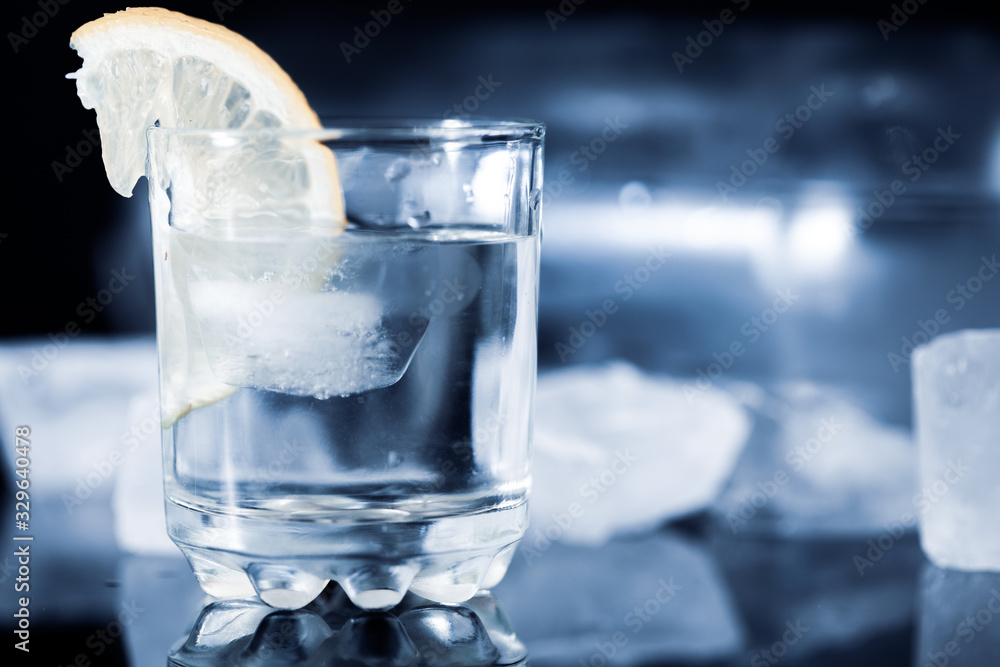 lemon on vodka of glass lemon on vodka of glass