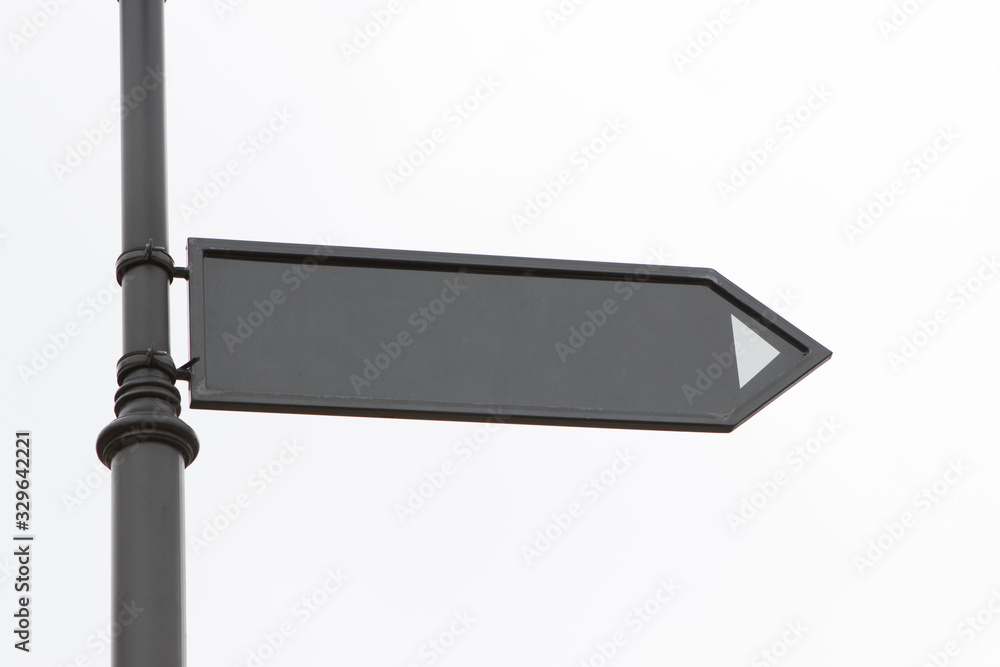Obraz premium one blank unsigned arrow pointer showing direction, the road sign is on the street on a white background