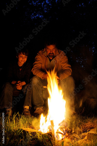 father and son by campfire