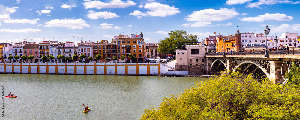 Panoramic view of the neighborhood of Triana along Guadalquivir river in Seville, Spain.