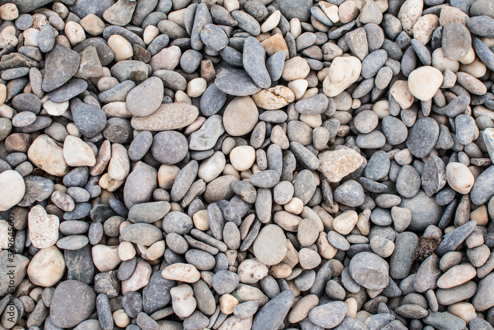 Sea pebbles. Background of pebbles. Wet stones. Multicolored pebbles. Sea shore. Sea pebbles. Background of pebbles. Wet stones. Multicolored pebbles. Sea shore.