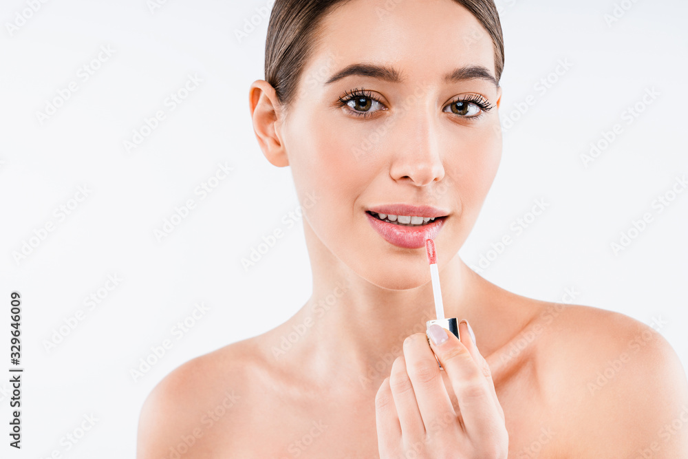 Beauty close up face portrait of pretty woman wearing lipstick or lip gloss on white