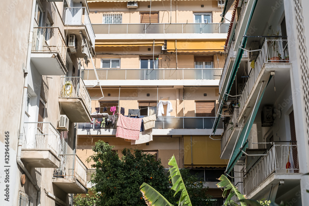 on the streets of Athens with blocks of flats and shops, Greece
