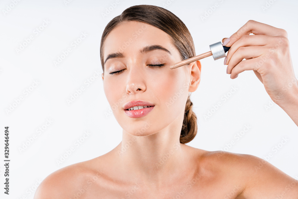 Beautiful woman portrait beauty skin perfect make up with tone cream on face isolated over white background Beautiful woman portrait beauty skin perfect make up with tone cream on face isolated over white background