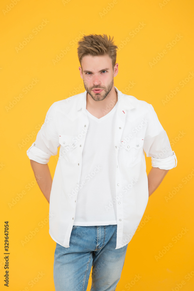 Casually handsome. Casual urban lifestyle. businessman in jeans and shirt. portrait of millennial man in casual clothes. Handsome man wear white tshirt and posing in studio Casually handsome. Casual urban lifestyle. businessman in jeans and shirt. portrait of millennial man in casual clothes. Handsome man wear white tshirt and posing in studio