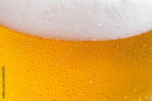 Light beer in a glass on a table in composition with accessories on an old background