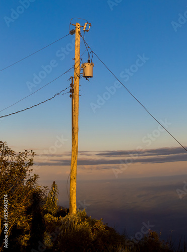 Power post with transformer, made of wood, Itambe State Park, Minas Gerais, Brazil photo