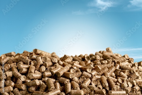 Wood chip pellets on sky background