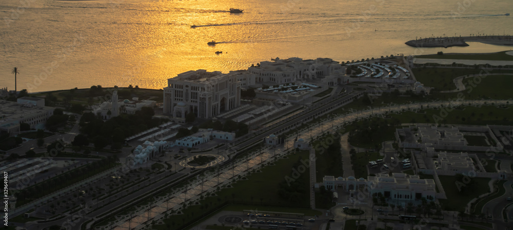 Fototapeta premium Beautiful panoramic view of the Ministry of Presidential Affairs and The Supreme Council for National Security in sunset in Abu Dhabi.