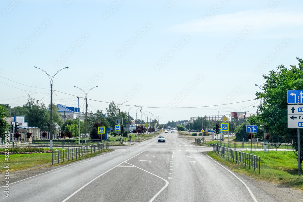 Fototapeta premium Asphalt road on which cars go. Landscape view from cab