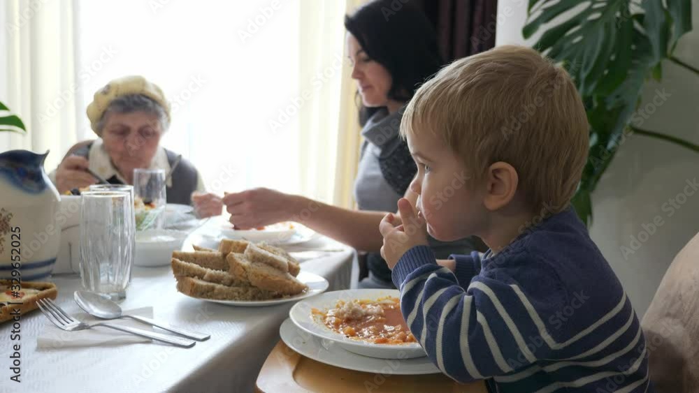 Multi Generation Family Having Dinner Enjoying Meal. Mother and Son Visit Great-grandmother and Spending Pleasant Holiday Time. Slow motion 0.5 speed 60 fps Multi Generation Family Having Dinner Enjoying Meal. Mother and Son Visit Great-grandmother and Spending Pleasant Holiday Time. Slow motion 0.5 speed 60 fps