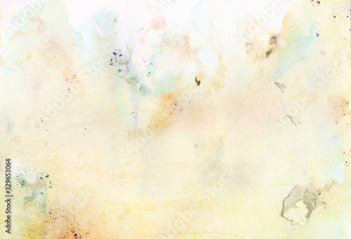 Colorful handmade paper background with liquid colors and stains, watercolor texture