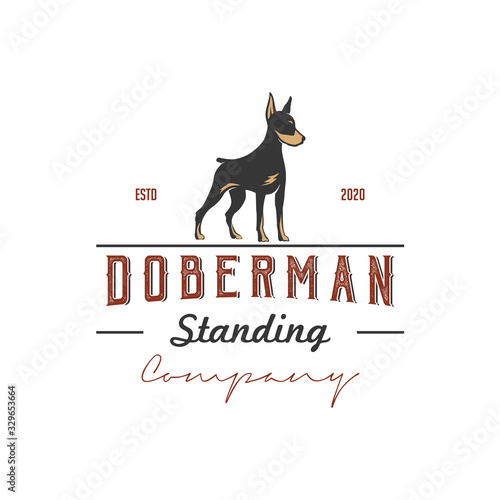 Silhouette of a standing doberman dog with retro vintage style logo design