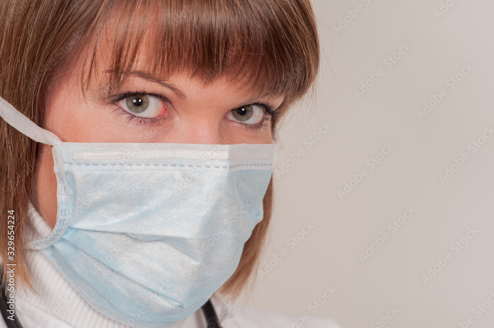 Close up of young nurse with protective mask Close up of young nurse with protective mask