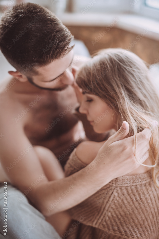 Stock photo - Portrait of happy loving couple at home