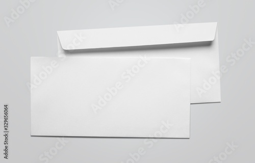 Blank card and white envelope on the desk photo