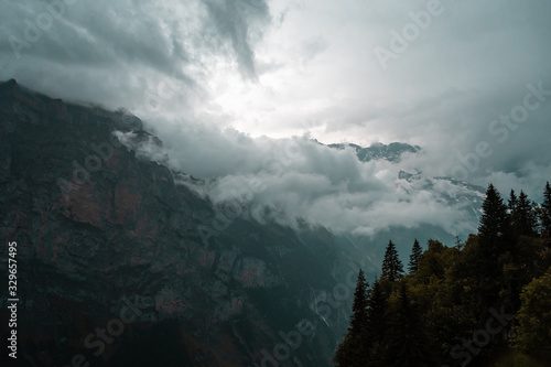 Gloomy dramatic mountain landscape. Atmospheric highland scenery in bad cloudy weather