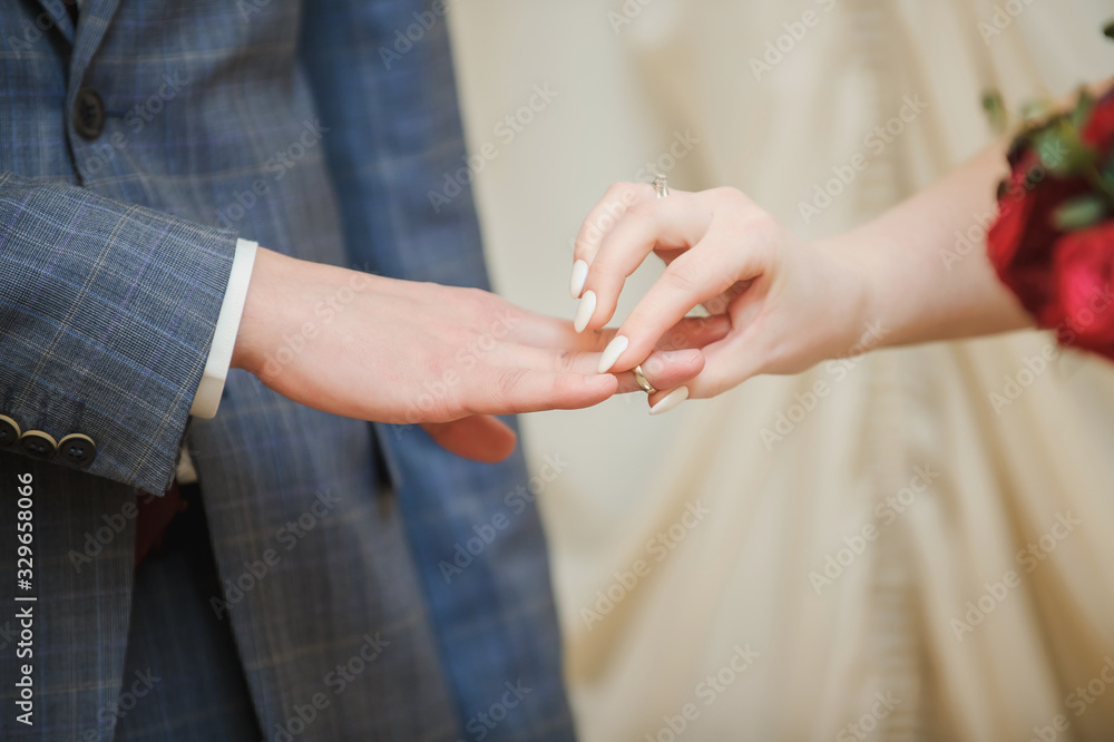 Religious marriage in the Orthodox church. Wedding matrimony. Exchanging wedding rings.