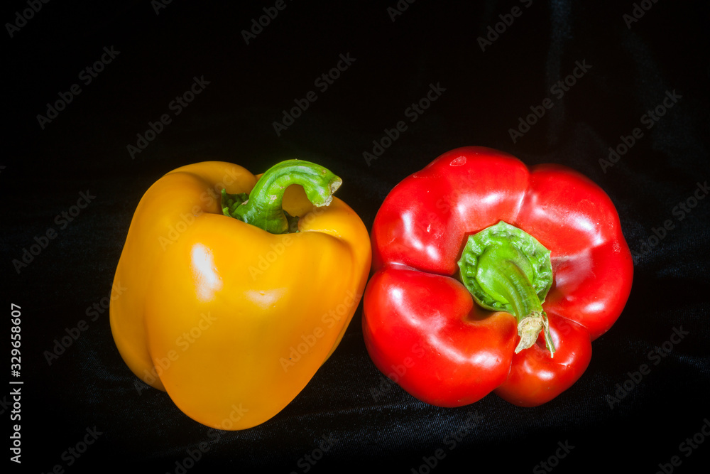 Red and Yellow Peppers on Black Red and Yellow Peppers on Black