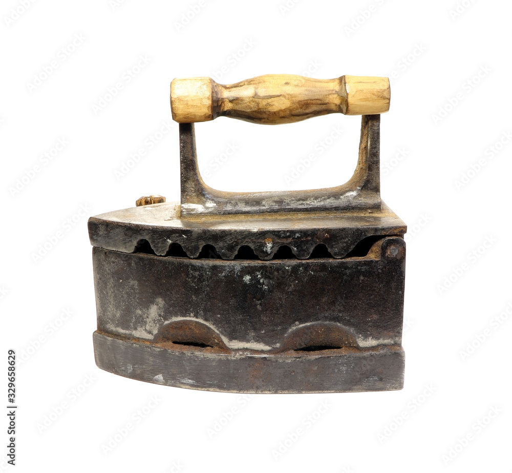 Old iron isolated on a white background. Antique, vintage iron. Old iron isolated on a white background. Antique, vintage iron.