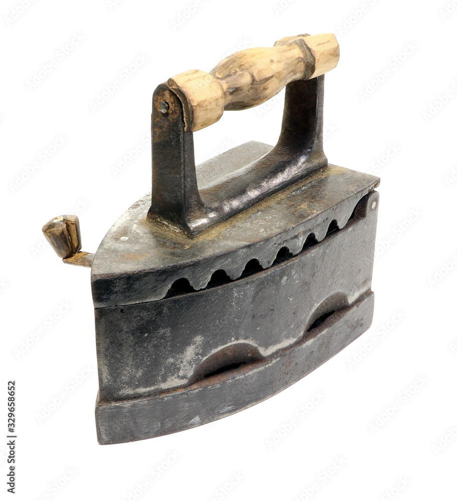 Old iron isolated on a white background. Antique, vintage iron. Old iron isolated on a white background. Antique, vintage iron.