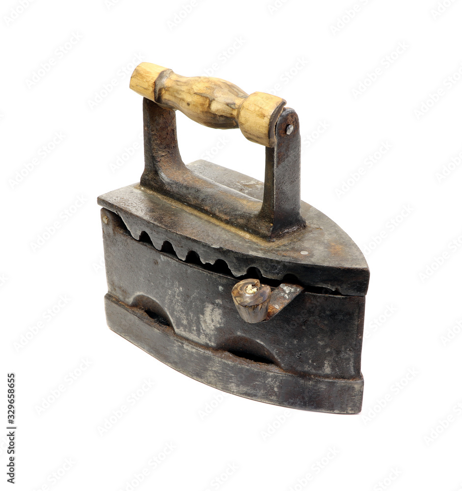 Old iron isolated on a white background. Antique, vintage iron. Old iron isolated on a white background. Antique, vintage iron.