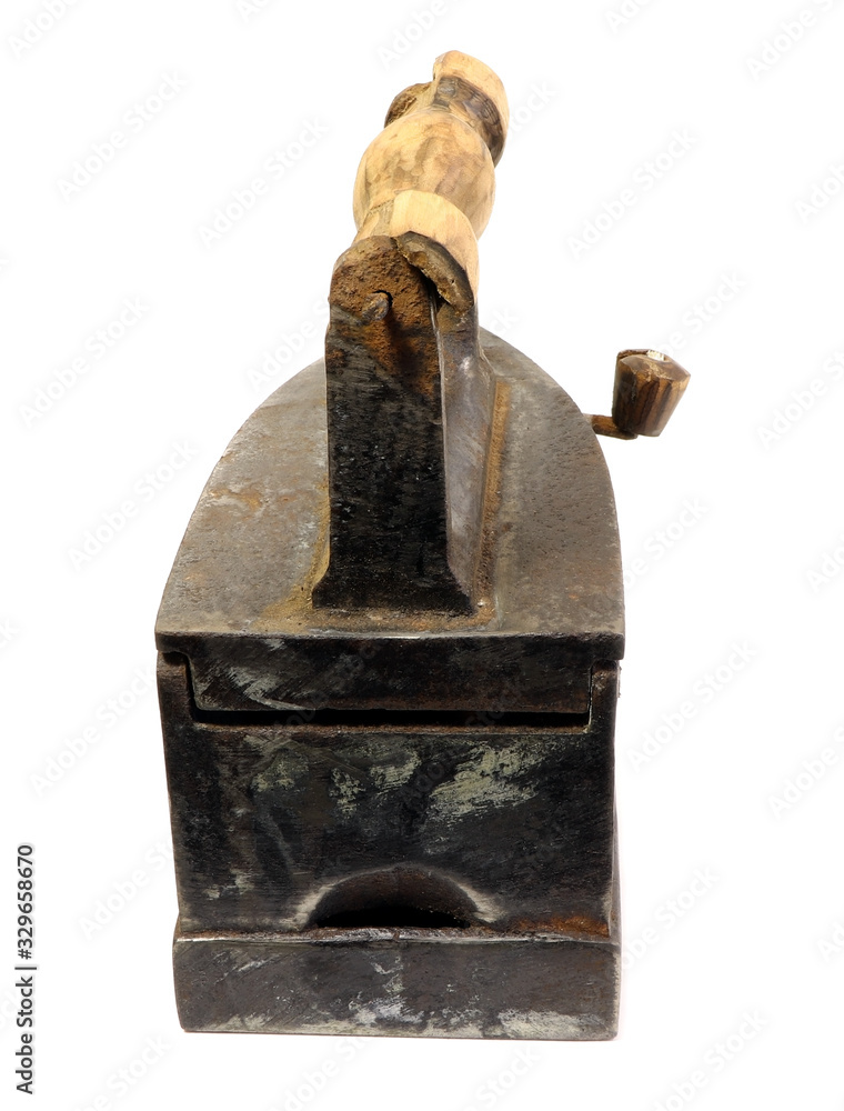 Old iron isolated on a white background. Antique, vintage iron. Old iron isolated on a white background. Antique, vintage iron.