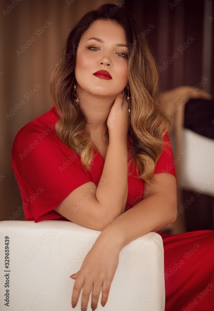 Portrait of beautiful young woman with makeup in fashion red clothes Portrait of beautiful young woman with makeup in fashion red clothes