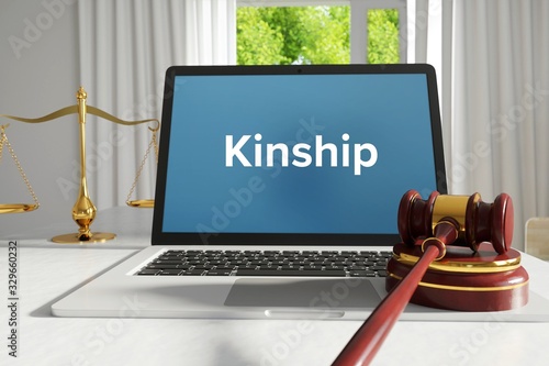 Kinship – Law, Judgment, Web. Laptop in the office with term on the screen. Hammer, Libra, Lawyer.