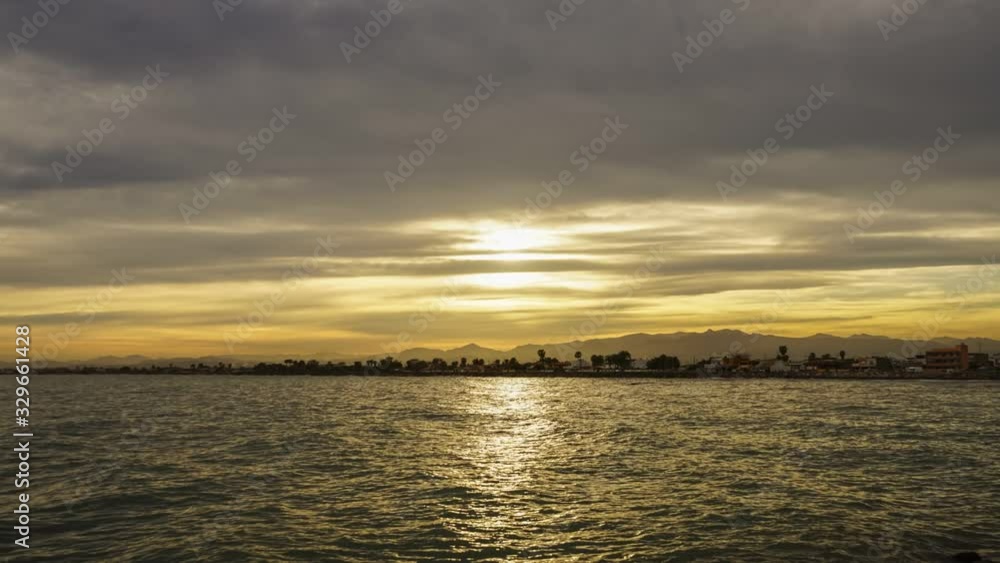 Time lapse in Burriana city with moving clouds in the blue sky Time lapse in Burriana city with moving clouds in the blue sky