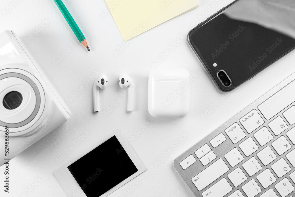 wireless headphones on white and wooden background wireless headphones on white and wooden background
