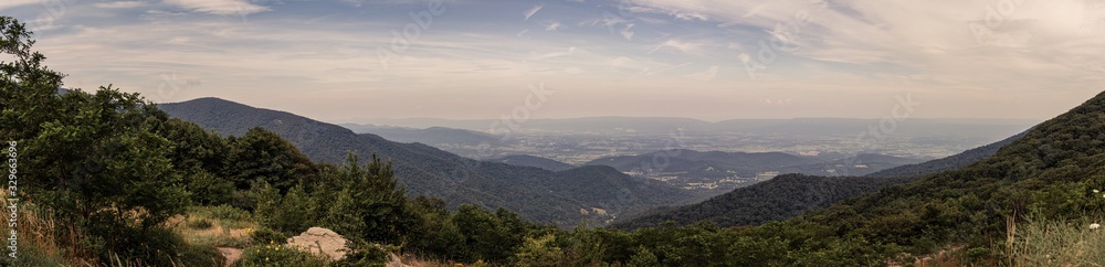 Panorama view of hills in nature with forest in Shenandoah at sunny day